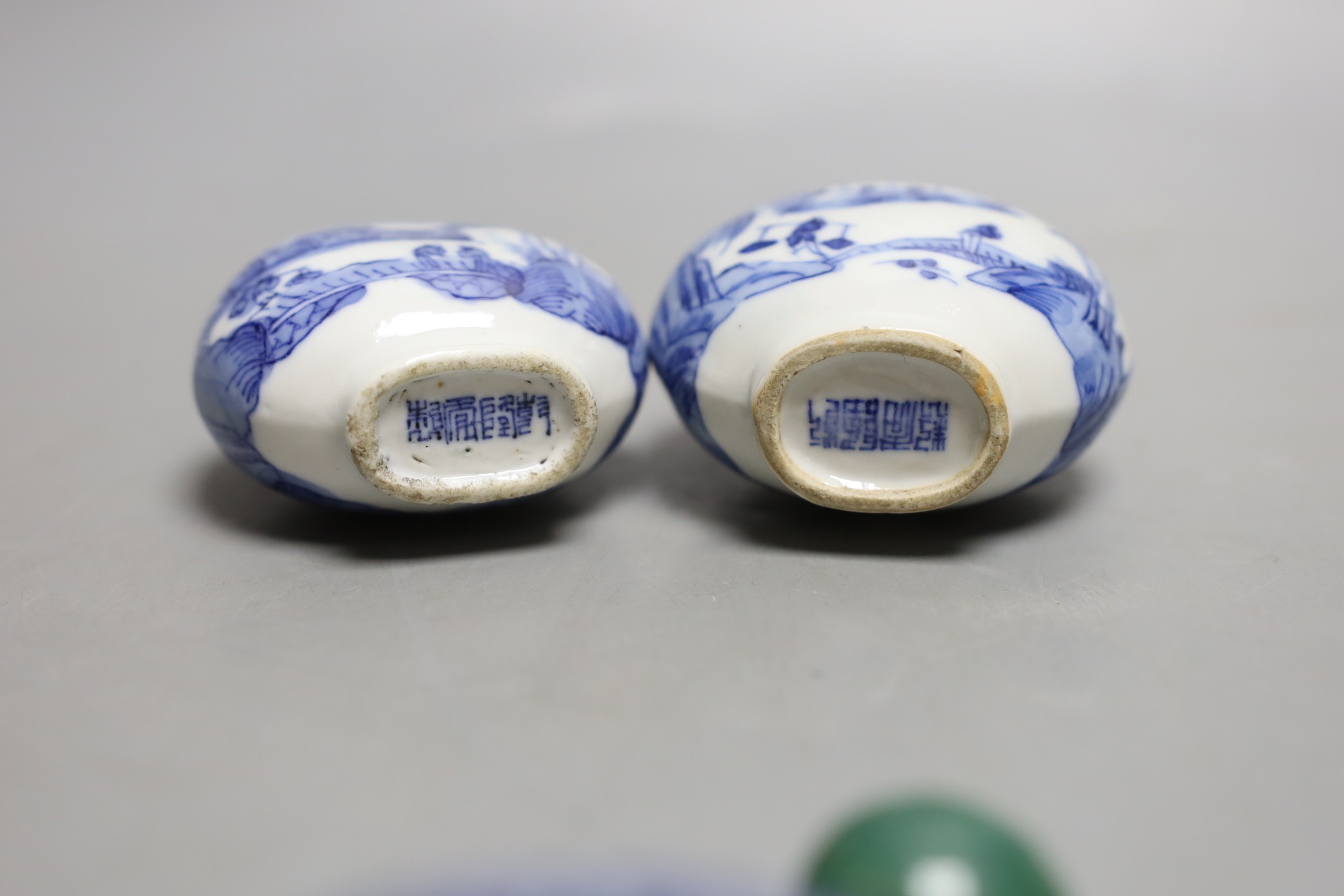 A Chinese blue and white seal paste box, brushwasher and a pair of snuff bottles, late 19th/early 20th century